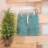 Pantalón corto en verde agua para bebé